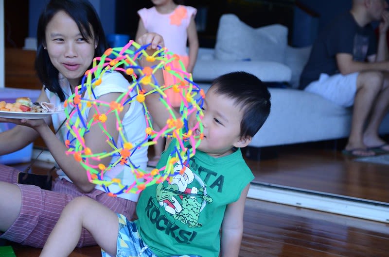 Child with Hoberman Sphere
